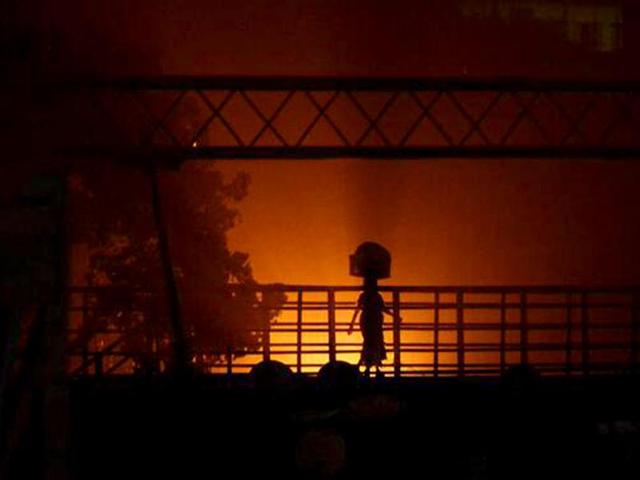 A woman walks down near Mahim station, Mumbai. (Photo: Kunal Khullar)