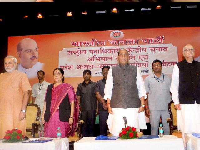 Rajnath Singh with LK Advani, Sushma Swaraj and Gujarat chief minister at the Party's National Election Campaign Committee meeting (PTI).