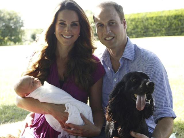 This-image-taken-by-Michael-Middleton-the-Duchess-s-father-and-supplied-by-Kensington-Palace-shows-the-Duke-and-Duchess-of-Cambridge-with-their-son-Prince-George-in-the-garden-of-the-Middleton-family-home-in-Bucklebury-England-with--their-pet-dog-AP-Photo