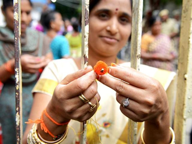 An activist holds a rakhi on the sidelines of a protest against the formation of Telangana state outside the Secretariat in Hyderabad. AFP