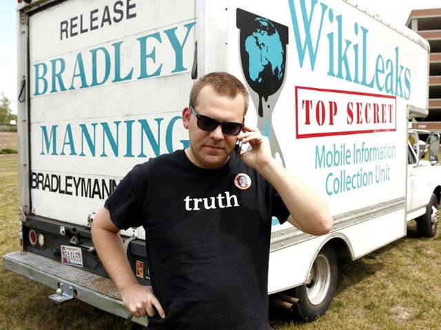 Activist Clark Stoeckley talks on the phone in front of his "WikiLeaks" truck in Hanover, Maryland following the sentencing of Bradley Manning. (Reuters Photo)