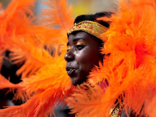 A performer takes part in the parade on the second day of the Notting Hill Carnival in London. (AFP Photo)