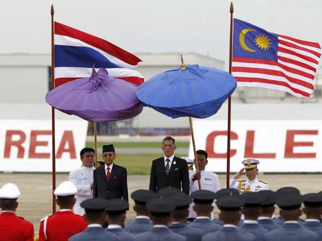 King Mizan Zainal Abidin of Malaysia and Thai Crown Prince Vajiralongkorn at the military airport in Bangkok, Thailand. (AP Photo)