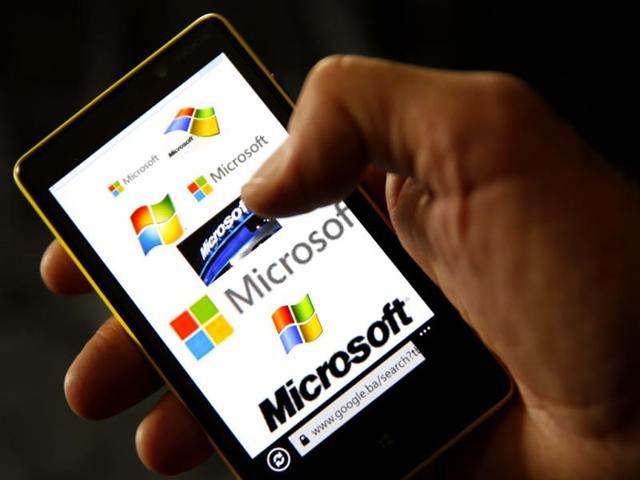A-Nokia-Lumia-820-smartphone-with-Microsoft-logos-on-the-screen-shown-in-a-photo-illustration-Reuters-Photo