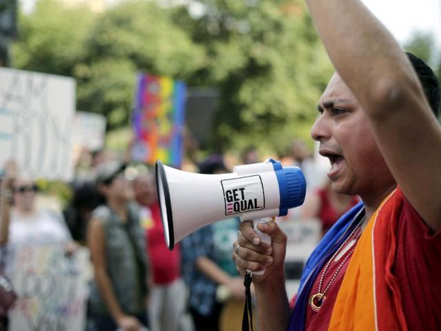 Supporters of a proposed ordinance prohibiting discrimination based on sexual orientation and gender identity rally outside the city council chambers in San Antonio, Texas. (AP Photo)