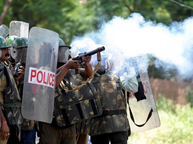 Police fire tear gas rounds against Osmania University students protesting against the 'Save Andhra Pradesh' meeting in Hyderabad. (AFP Photo)