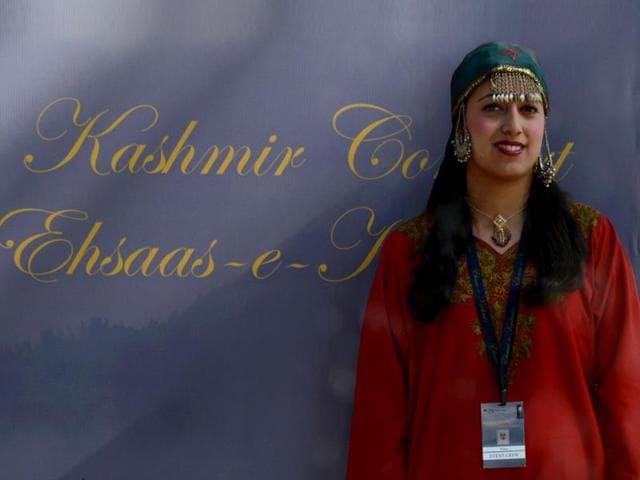 A Kashmiri Muslim wearing a traditional dress looks on before the Ehaas-Kashmir music concert in Srinagar. (AFP Photo)