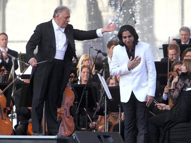 Renowned music conductor Zubin Mehta with Music Composer Abhay Rustum Sopori after performing a composition during a concert 'Ehsaas-e-Kashmir’ (Feel of Kashmir) at Shalimar Bagh in Srinagar. (PTI Photo)