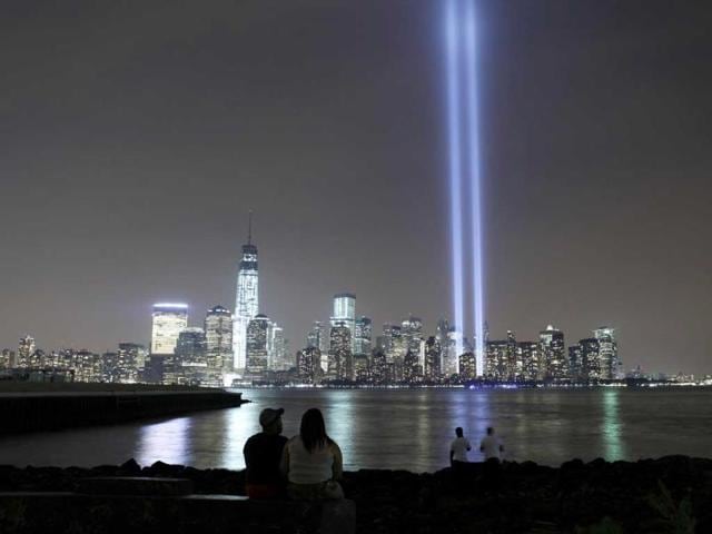 The-Tribute-in-Light-is-illuminated-next-to-One-World-Trade-Center-as-people-look-across-the-Hudson-River-in-Jersey-City-New-Jersey-September-11-2013-Reuters-Photo The-Tribute-in-Light-is-illuminated-next-to-One-World-Trade-Center-as-people-look-across-the-Hudson-River-in-Jersey-City-New-Jersey-September-11-2013-Reuters-Photo