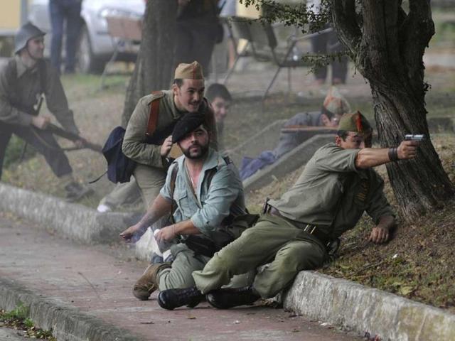 An actors takes part in a re-enactment of the "Battle of Areces" that took place during the Spanish Civil War, in Grullos, north of Spain, September 14, 2013. The re-enactment of the historic 1937 battle was organised by the Frente del Nalon Association. REUTERS