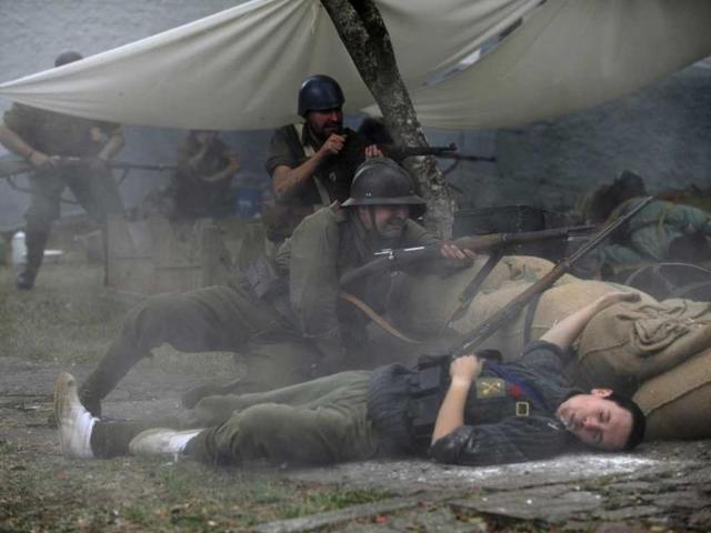 An actors takes part in a re-enactment of the "Battle of Areces" that took place during the Spanish Civil War, in Grullos, north of Spain, September 14, 2013. The re-enactment of the historic 1937 battle was organised by the Frente del Nalon Association. REUTERS