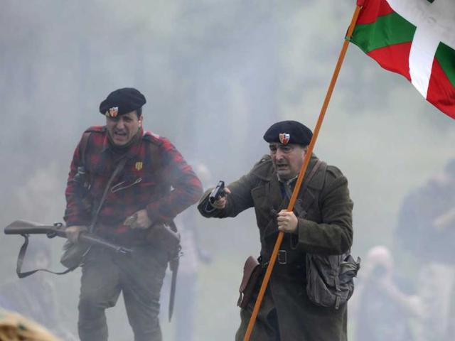 An actors takes part in a re-enactment of the "Battle of Areces" that took place during the Spanish Civil War, in Grullos, north of Spain, September 14, 2013. The re-enactment of the historic 1937 battle was organised by the Frente del Nalon Association. REUTERS