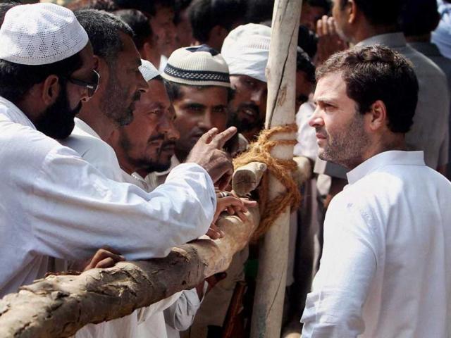 Congress Vice President Rahul Gandhi interacts with families of riot victims at Bassi Kalan relief camp in Muzaffarnagar on Monday. (PTI Photo)