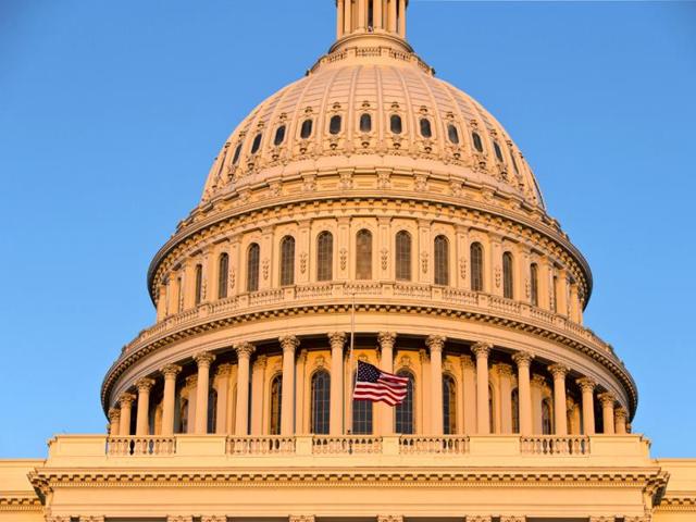 The American flag flies at half-staff over the US Capitol at sunset following the shooting at the Washington Navy Yard on Monday in Washington. (AP Photo)