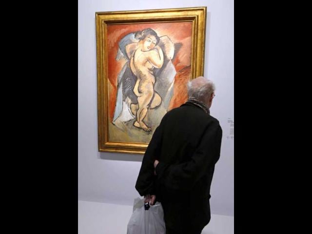 A visitor looks at the painting Grand nu by French artist Georges Braque during an exhibition at the Grand Palais Museum in Paris. Reuters Photo