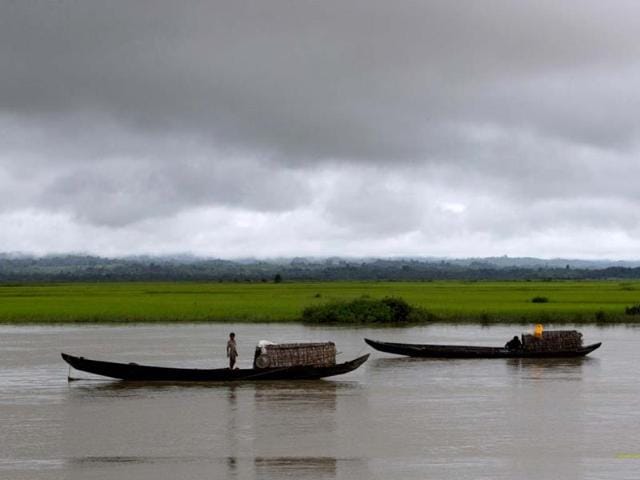 Villagers transport merchandises in a river close to Buthidaung in Rakhine state, Myanmar. Photo: AP/Gemunu Amarasinghe