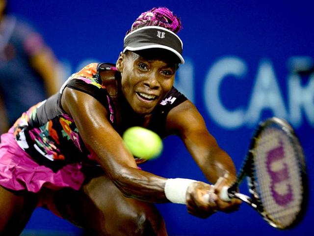 Venus Williams returns a shot against Eugenie Bouchard during their quarter-final match in the Pan Pacific Open tennis tournament in Tokyo. AFP photo