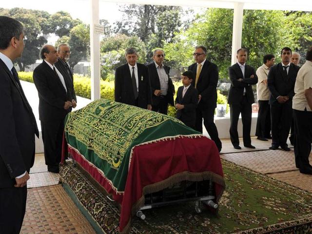 Family members stand by the coffin of Kenyan journalist Ruhila Adatia-Sood during her funeral ceremony in Nairobi. (AFP Photo)