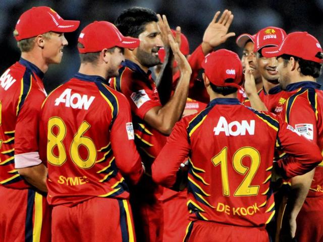 Highveld Lions bowler Sohail Tanveer (c) with teammates celebrate the wicket of Mumbai Indians batsman Sachin Tendulkar during their Champions League Twenty 20 cricket match in Jaipur. (PTI Photo)