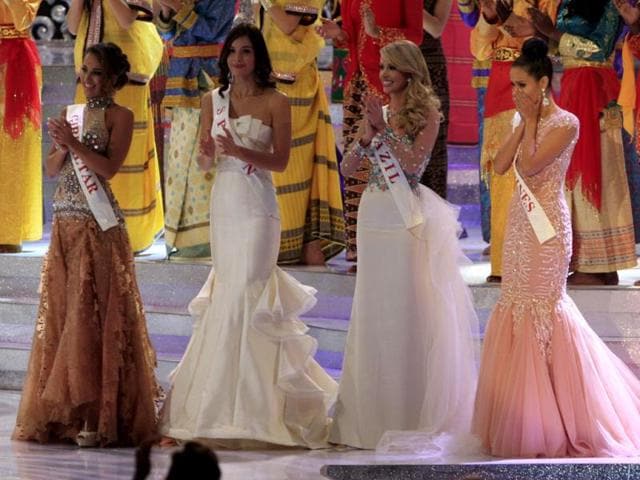 Miss Philippine Megan Young (R) reacts after winning the Miss World pageant final in Nusa Dua, Bali, Indonesia. (AP Photo)