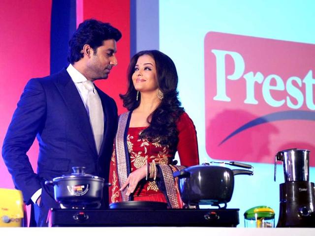 Aww moment! Abhishek Bachchan and his wife Aishwarya Rai Bachchan during a press conference as the brand ambassadors of the TTK Prestige kitchen appliances in Mumbai. (AFP Photo)