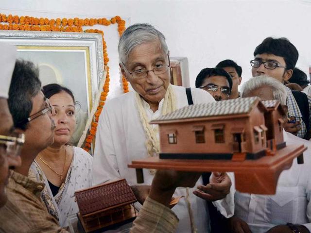 Rajmohan-Gandhi-grandson-of-Mahatma-Gandhi-looks-at-a-copper-model-of-Sabarmati-Gandhi-Ashram-on-the-occasion-of-his-144th-birth-anniversary-in-Ahmedabad-PTI-Photo Rajmohan-Gandhi-grandson-of-Mahatma-Gandhi-looks-at-a-copper-model-of-Sabarmati-Gandhi-Ashram-on-the-occasion-of-his-144th-birth-anniversary-in-Ahmedabad-PTI-Photo
