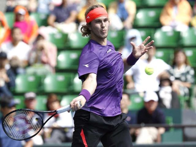 Lukas Lacko of Slovakia returns a shot against Edouard Roger-Vasselin of France during their second round match at the Japan Open Tennis Championships in Tokyo.(AP photo)