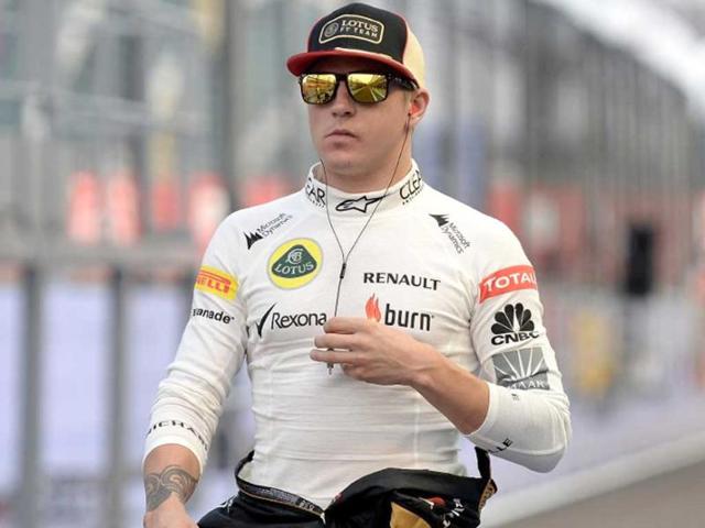 Lotus-driver-Kimi-Raikkonen-walks-in-the-pitlane-during-the-third-practice-session-of-the-Formula-One-Singapore-GP-AFP-photo