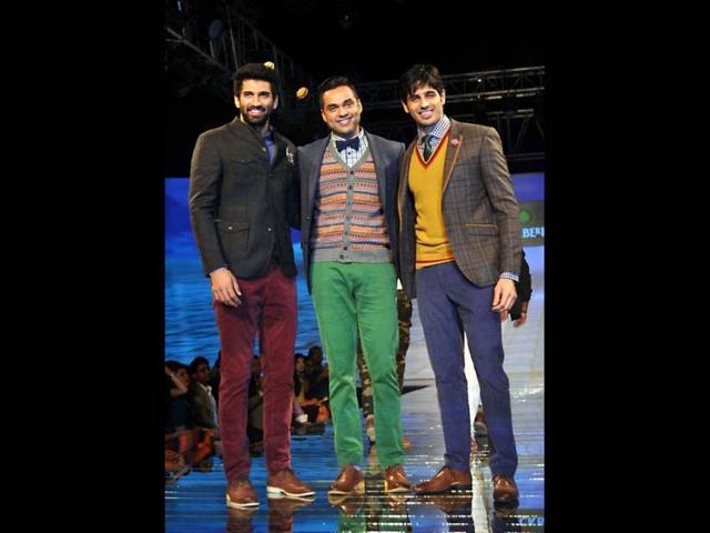 Aditya Roy Kapur, Abhay Deol and Sidharth Malhotra walk the ramp for Showstoppers Blackberry's Sharp Nights Progressive fashion show. (AFP Photo)