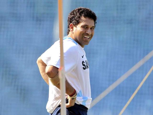 Sachin Tendulkar smiles during a training session ahead of their third test cricket match against West Indies in Mumbai in 2011. (AP Photo)