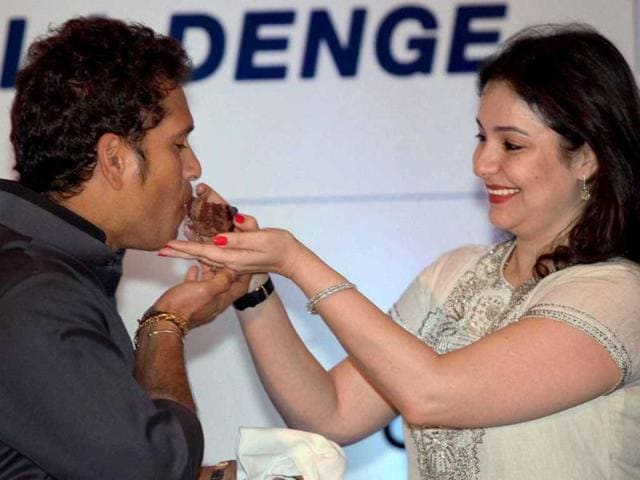 Master blaster Sachin Tendulkar is offered a piece of cake by his wife Anjali during his 40th birthday celebration in Kolkata in April 2013. (PTI Photo)
