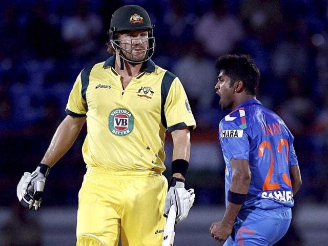 Vinay Kumar celebrates the wicket of Shane Watson of Australia during the India-Australia T20 match in Rajkot. (PTI Photo)
