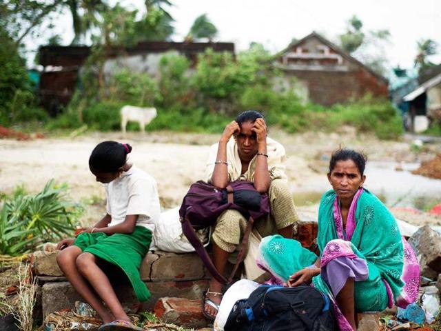 A displaced family waits in Sonupur village, 15 kms from Gopalpur. (AFP Photo)