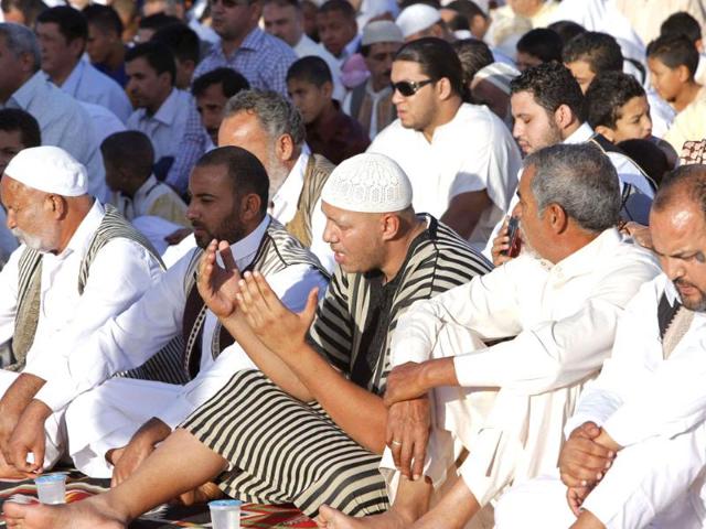 Muslims attend Eid al-Adha prayers at Martyrs' Square in Tripoli to mark the end of the haj pilgrimage. (Reuters photo)