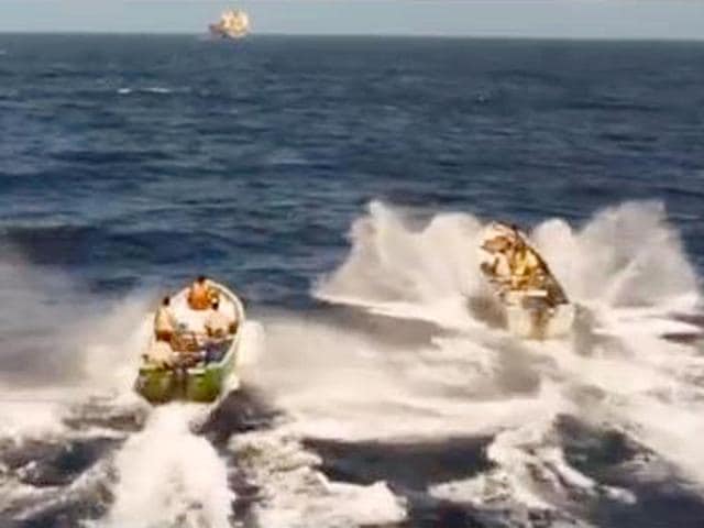 Boats set out to attack the Captain's ship.