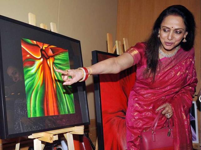 Bollywood actress Hema Malini poses for a photo during the inauguration of the art and couture exhibition Sarvam-Shashvatam in Mumbai on October 14, the eve of her 65th birth anniversary. Browse through a pictorial journey of her Bollywood life .(AFP Photo) Bollywood actress Hema Malini poses for a photo during the inauguration of the art and couture exhibition Sarvam-Shashvatam in Mumbai on October 14, the eve of her 65th birth anniversary. Browse through a pictorial journey of her Bollywood life .(AFP Photo)