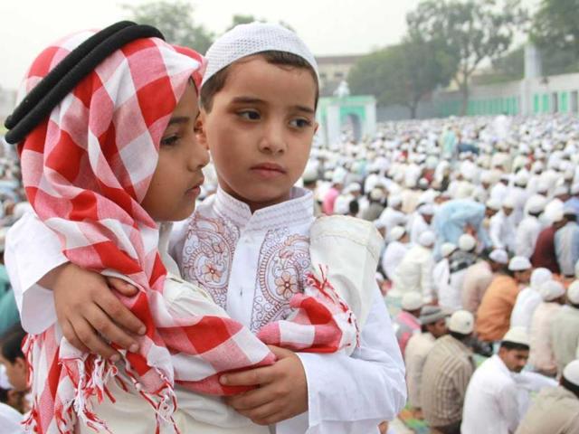 Muslims offer Eid al-adha prayer, in Muzaffarnagar. This is the first eid festival in town after it witnessed communal riot recenlty.(Photo by Hindustan Times)