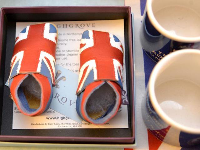 A pair of union flag covered baby boots, to celebrate the birth of Prince George, seen at the house of Margaret Tyler who has dedicated her house as a shrine to the family. (Reuters Photo)