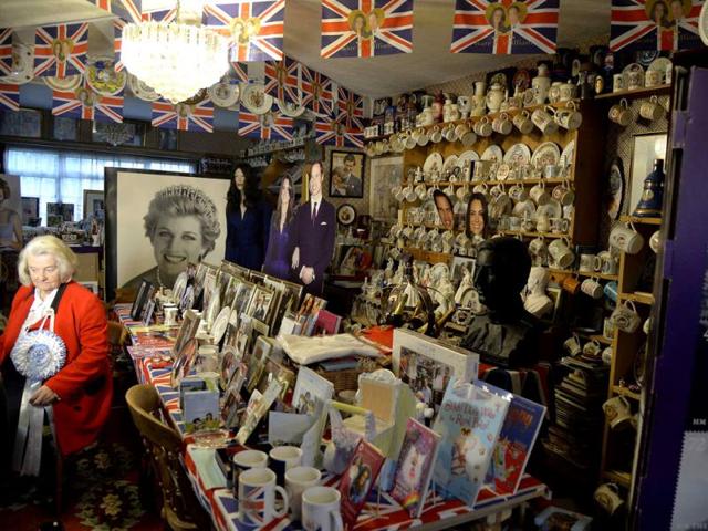 Margaret Tyler sits with royal paraphernalia at her house, which she has dedicated as a shrine to the British royal family. (Reuters Photo)