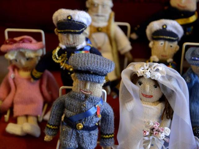 Commemorative puppets representing the wedding of the Britain's Prince William and his wife Catherine, seen at Margaret Tyler's house. (Reuters Photo)