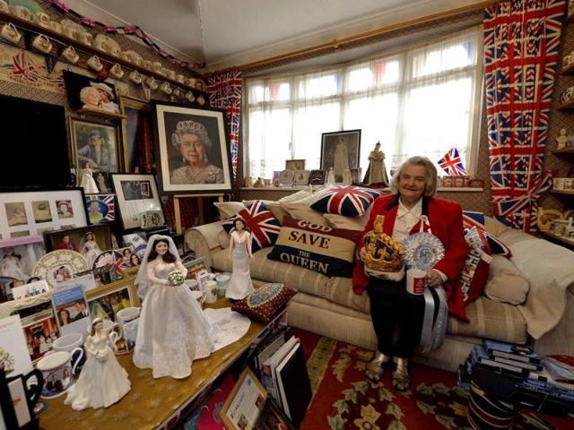 Margaret Tyler sits in the front room of her house, which she has dedicated as a shrine to the British royal family. (Reuters Photo)