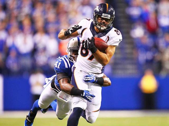 Eric Decker #87 of the Denver Broncos catches a pass against Antoine Bethea #41 of the Indianapolis Colts at Lucas Oil Stadium in Indianapolis, Indiana. (AFP Photo)