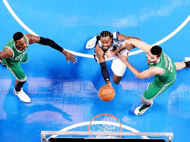 Minnesota Timberwolves center Ronny Turiaf battles for a rebound with Boston Celtics forward Jeff Green and teammate Vitor Faverani during the third quarter at the Bell Centre. (Eric Bolte-USA TODAY Sports)