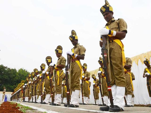 Policemen pay homage during a parade to police martyrs on the occasion of National Police Commemoration Day in Hyderabad. (AFP Photo)