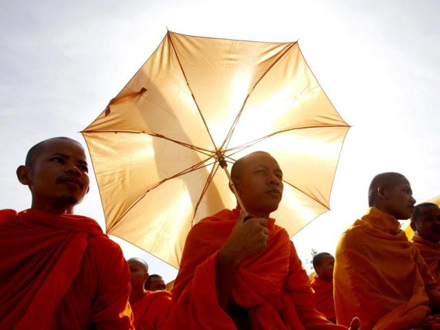 Buddhist monks, who are supporters of the opposition Cambodia National Rescue Party (CNRP), gather during a protest at the Freedom Park in central Phnom Penh. (Reuters Photo)