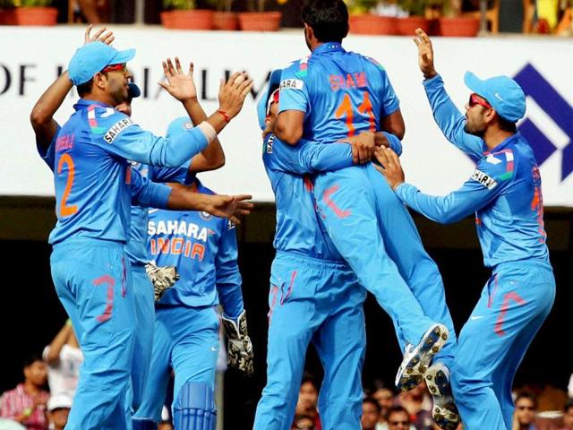 Mohd Shami celebrates with teammates after claiming Australia's Shane Watson's wicket during the 4th ODI match in Ranchi. (PTI photo)