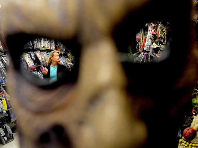 A woman shops for Halloween decorations at a store in Rockville, Maryland. (AFP Photo)