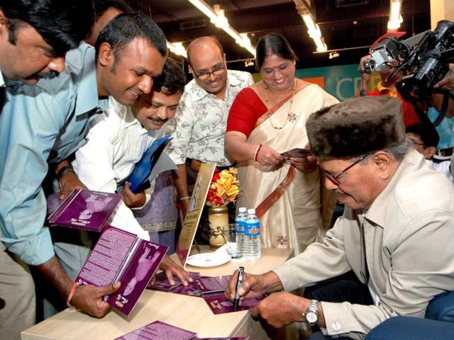 Manna Dey's magic continued to mesmerize people even years after the era of classical music was submerged in rock and pop music. In a file photo, Dey signs his DVD sets 'Manna Dey - The Ultimate Unremix' in Bangalore on March 20, 2008. (PTI Photo)