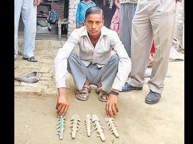 The-Bajpur-farmer-shows-the-ancient-arrows-and-hunting-tools-that-were-unearthed-from-his-field-while-ploughing-HT-photo