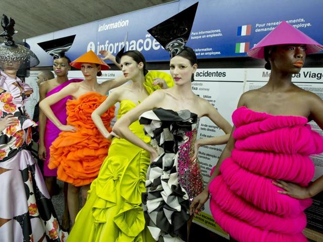Models wearing collections of previous editions of the Sao Paulo Fashion Week, stand inside a subway station in Sao Paulo, Brazil. (AP Photo)